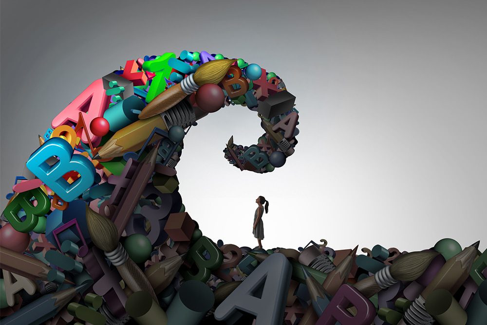 Article-2c-1000w - Building Wings An animated character of a child looks up at a large pointed peak made out of colorful giant letters and art supplies