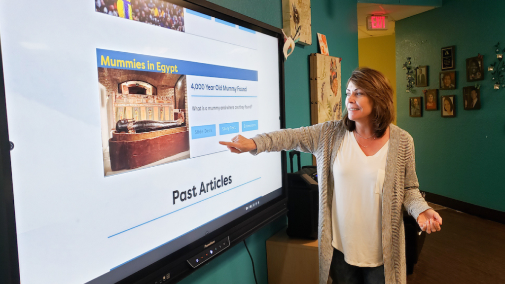 A teacher building background knowledge with world news articles - Building Wings