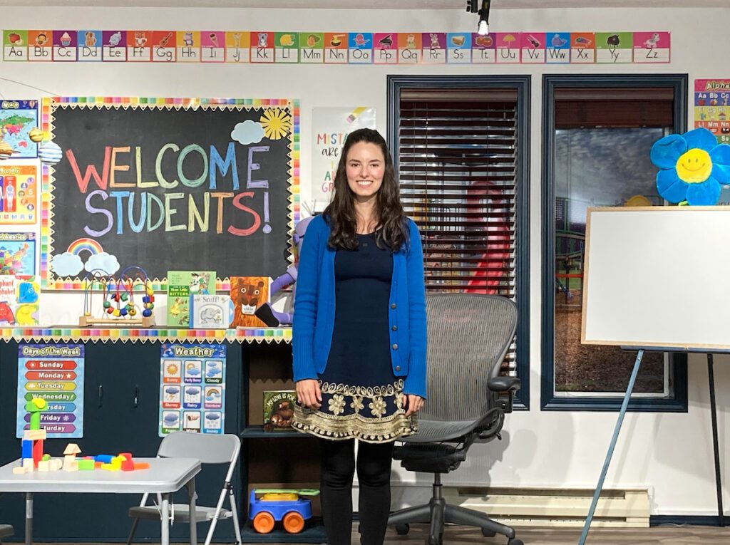 Teaching Tutorials - Building Wings Classroom setting with a teacher using visuals to welcome learners showing morning message ideas.