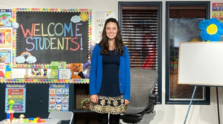 Classroom setting with a teacher using visuals to welcome learners showing morning message ideas.