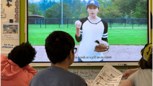 Learners watching a video about baseball - a multimodal learning approach to build background knowledge.