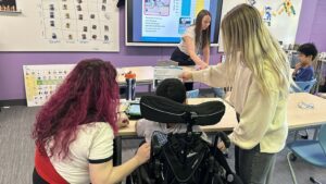 Special educators and related services staff provide specially designed literacy instruction and communication supports to students with complex learning needs.